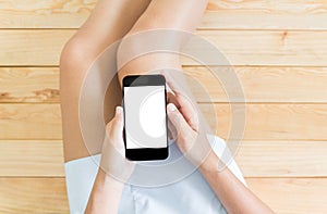 Woman using smartphone white screen