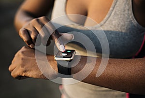 A woman using a smartwatch