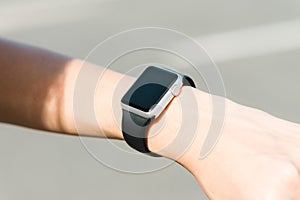 Woman using smartwatch with e-mail notifier. smartwatch hand device notify computer internet message e-mail concept. photo