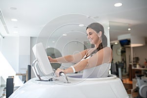 Woman using a spa treadmill in a gym