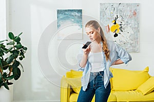 Woman using speakerphone while having conversation