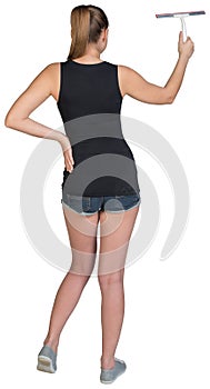 Woman using squeegee. Rear view