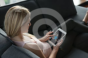 Woman using tablet in beautiful apartment