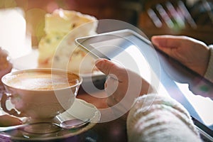 Woman using tablet in the cafe