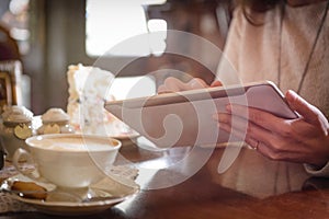 Woman using tablet in the cafe