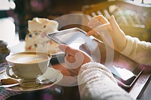 Woman using tablet in the cafe