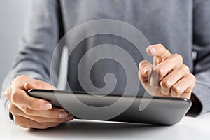 Woman using tablet computer for stock trading