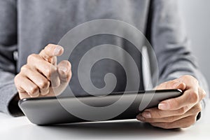 Woman using tablet computer for stock trading