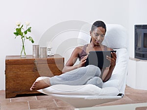 Woman using tablet pc at home