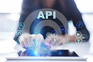 Woman is using tablet pc, pressing on virtual screen and selecting api