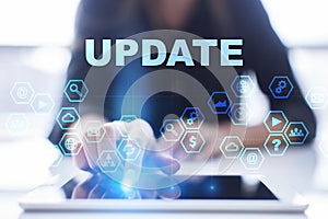 Woman is using tablet pc, pressing on virtual screen and selecting update