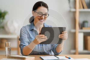 Woman is using tablet pc for remote conversation