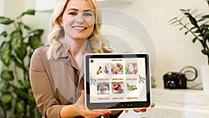 Woman using tablet to order food delivery at home