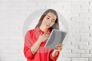 Woman using tablet for video chat