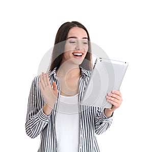 Woman using tablet for video chat on white