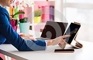 Woman using tech gadgets in the office