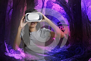 Woman enjoy virtual simulation of halloween night in metavard world photo