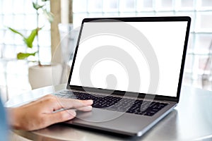 A woman using and touching on laptop computer touchpad with blank white desktop screen