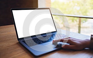 A woman using and touching on laptop touchpad with blank white desktop screen