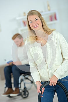 Woman using vacuum cleaner