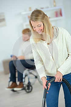 Woman using vacuum cleaner