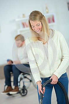 Woman using vacuum cleaner