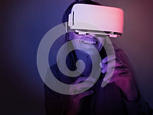 A woman is using virtual reality goggle