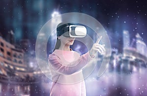 Woman using virtual reality headset and getting in simulated futuristic world