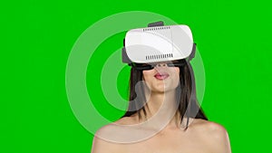 Woman using virtual reality headset, VR mask, close up. Green screen