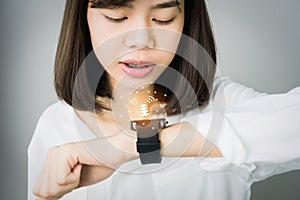 Woman using voice commands in digital clock in the display and technology advances in communication. photo