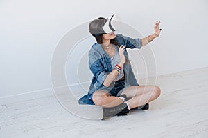 Woman using VR device in studio
