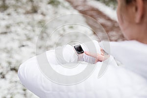 Woman using wearable tech during fitness activities