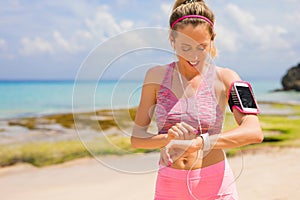 Woman using wearable tech during workout