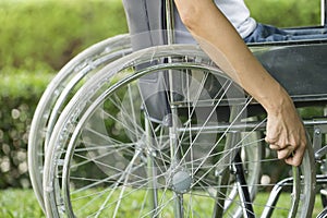 Woman using a wheelchair in a park