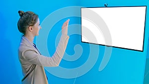 Woman using white empty interactive display