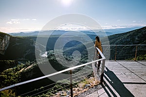 Woman on vacation in the Ardeche France Pont d Arc, Ardeche France,view of Narural arch in Vallon Pont D`arc in Ardeche