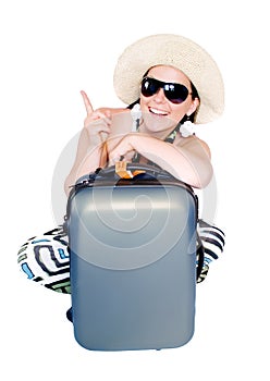 Woman on vacation with suitcase over white