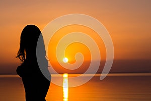 Woman at vacation at sunset, tourism concept