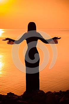 Woman at vacation at sunset, tourism concept