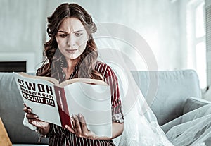 Woman in a vail reading about marriage