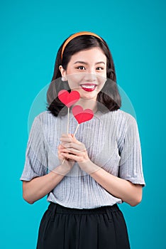 Woman on Valentine`s Day. Young asian beautiful girl holding red