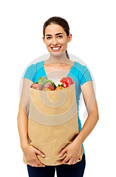 Woman With Vegetables Bag Over White Background