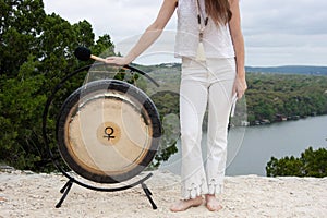 Woman With Venus Gong Outdoors