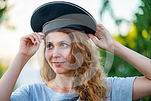 woman in a vest and capless cap