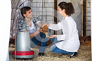 Woman veterinarian consulting man farmer