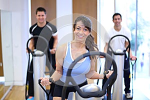 Woman on vibration plate in a gym