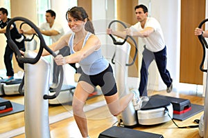 Woman on vibration plate in a gym