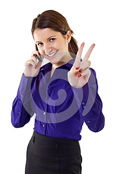 Woman with victory gesture and mobile phone