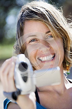Woman with video camera.