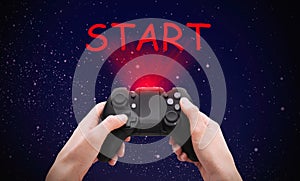 Woman with video game controller and word START against night sky